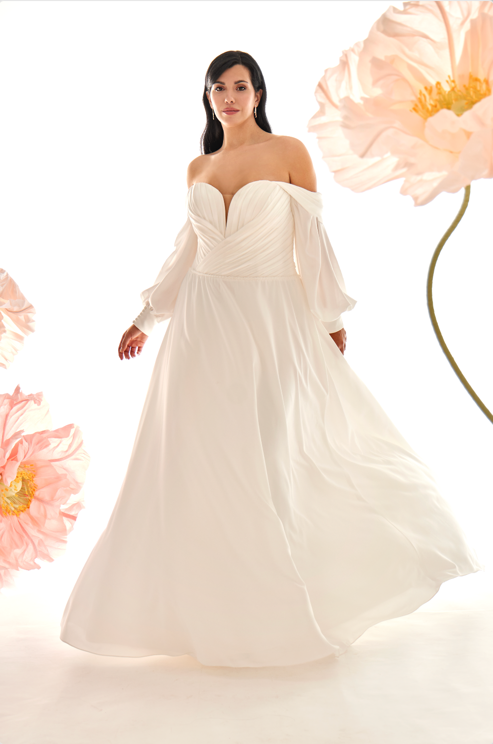 Woman in a white wedding dress with floral background