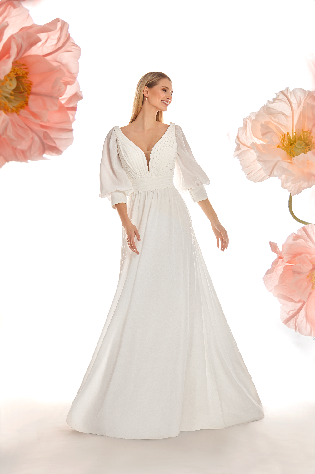 Woman wearing a white dress with floral background
